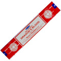 Red and white package of Nag Champa Dragon's Blood incense on a white background