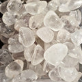 A pile of tumbled clear quartz