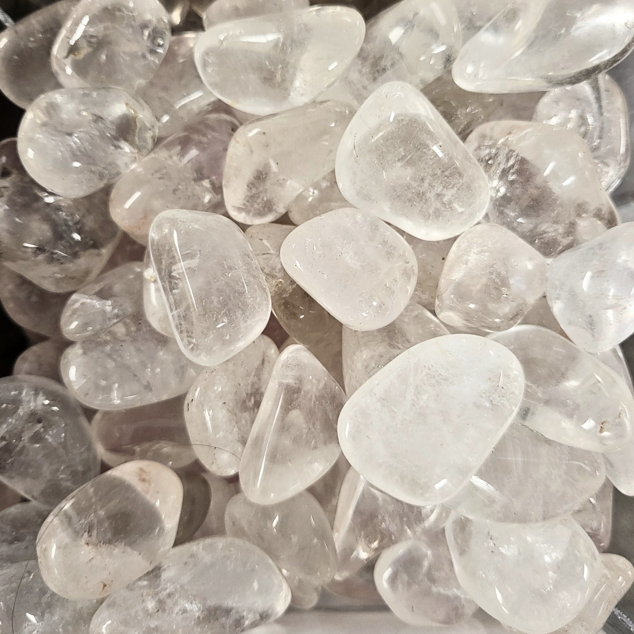A pile of tumbled clear quartz