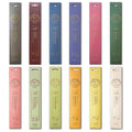 Assorted incense sticks in various colors with labels on a white background