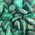 A pile of tumbled malachite 