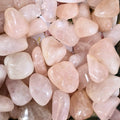 A pile of tumbled rose quartz