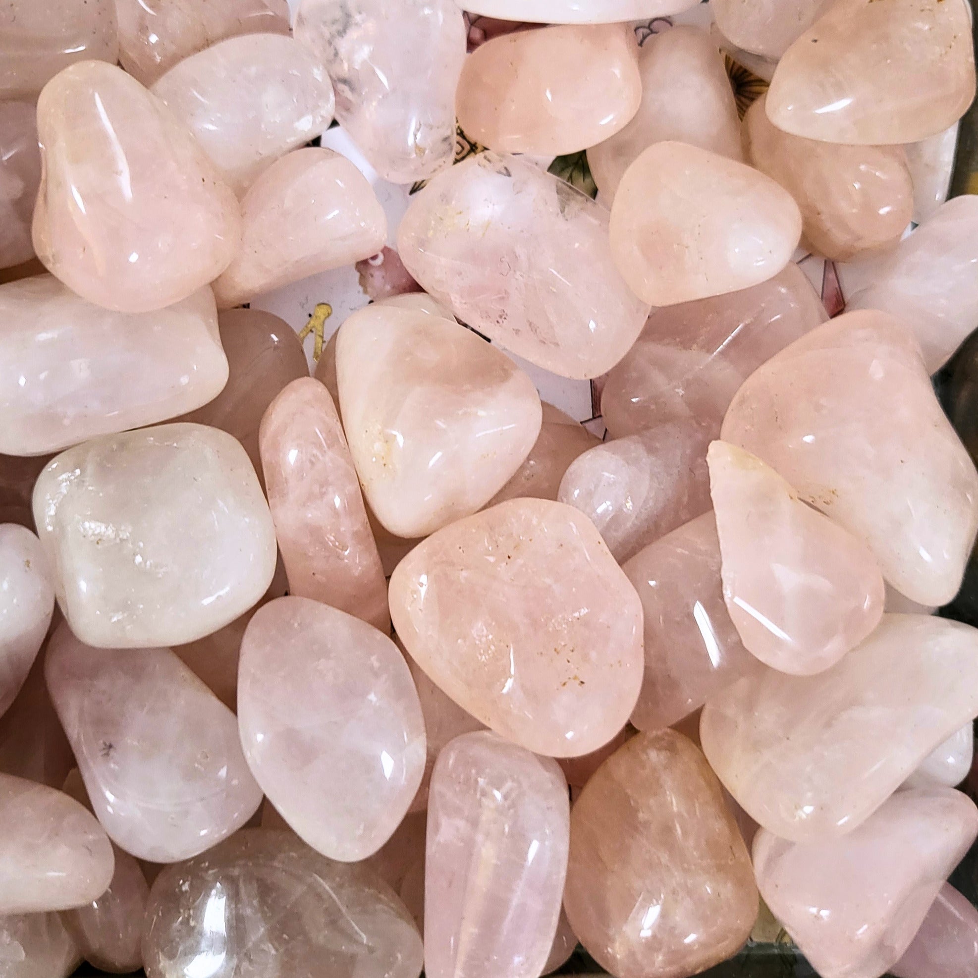 A pile of tumbled rose quartz