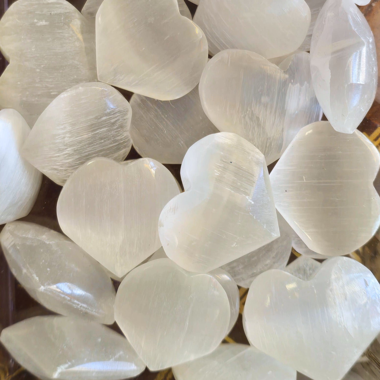 A pile of small Selenite Crystal hearts