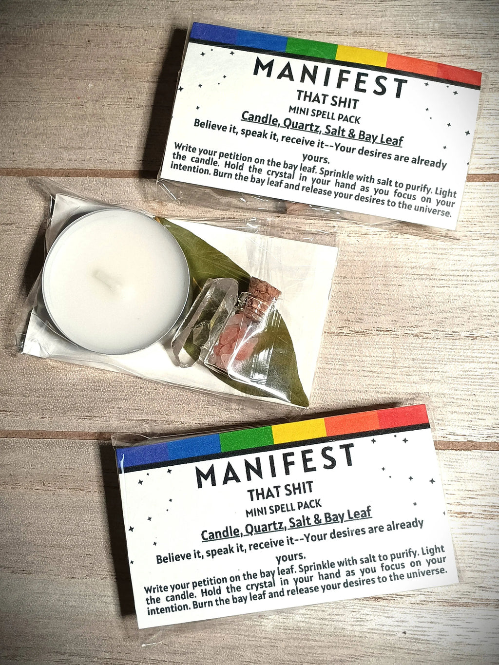 Manifestation spell pack with candle, salt, and bay leaf on a wooden surface