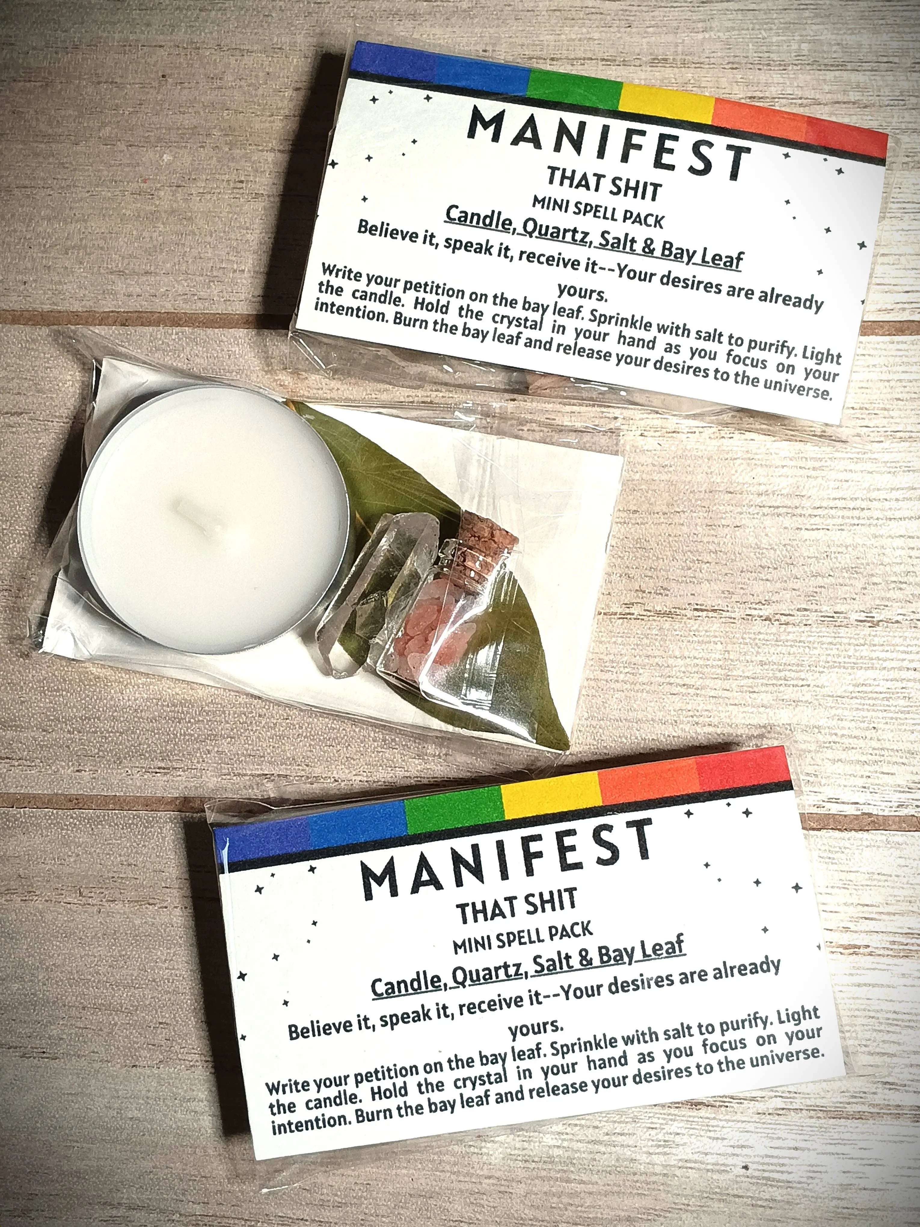 Manifestation spell pack with candle, salt, and bay leaf on a wooden surface