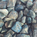 A pile of tumbled blue apatite crystals