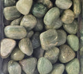 A pile of green aventurine tumbles 