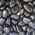 A pile of tumbled hematite