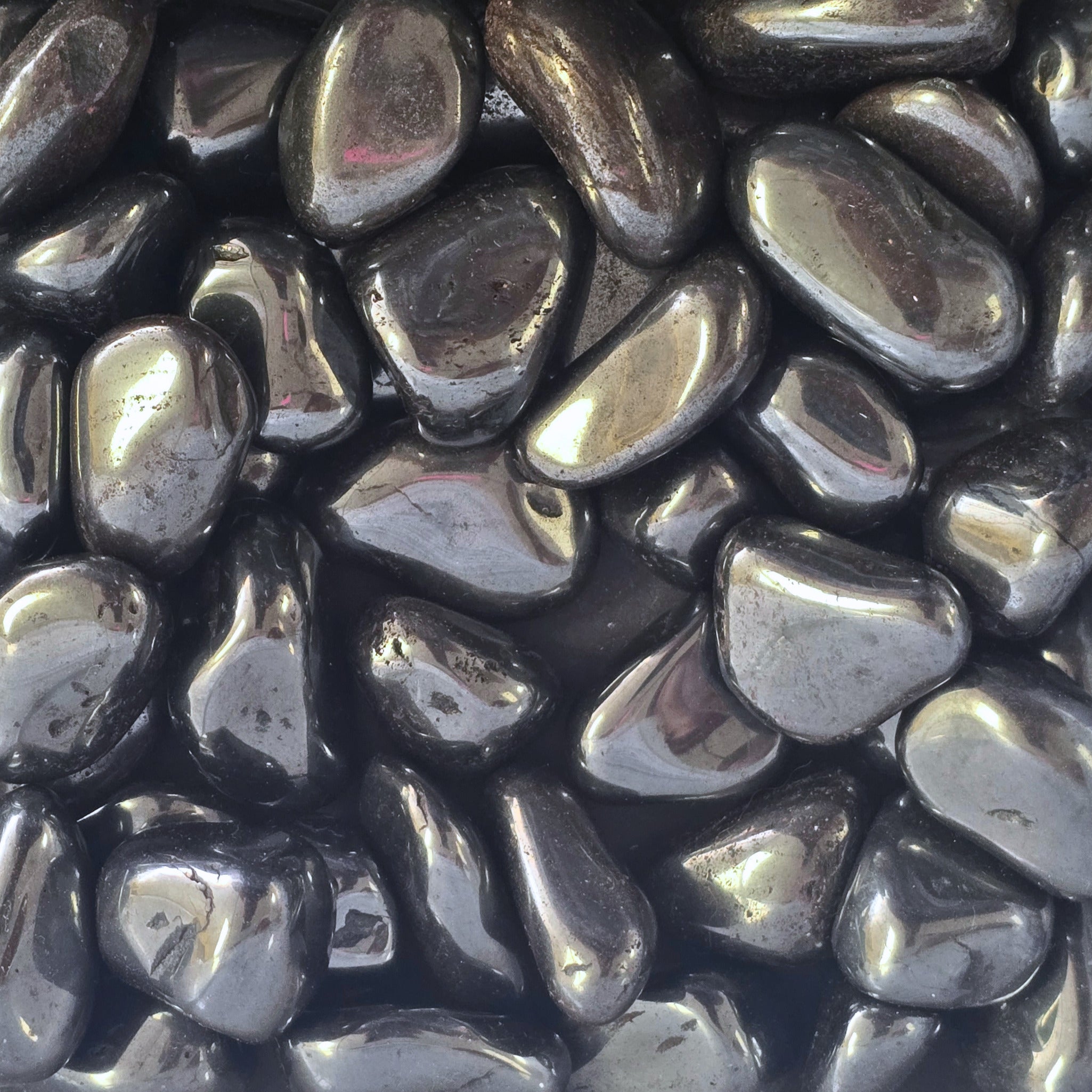 A pile of tumbled hematite