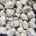 A pile of tumbled howlite