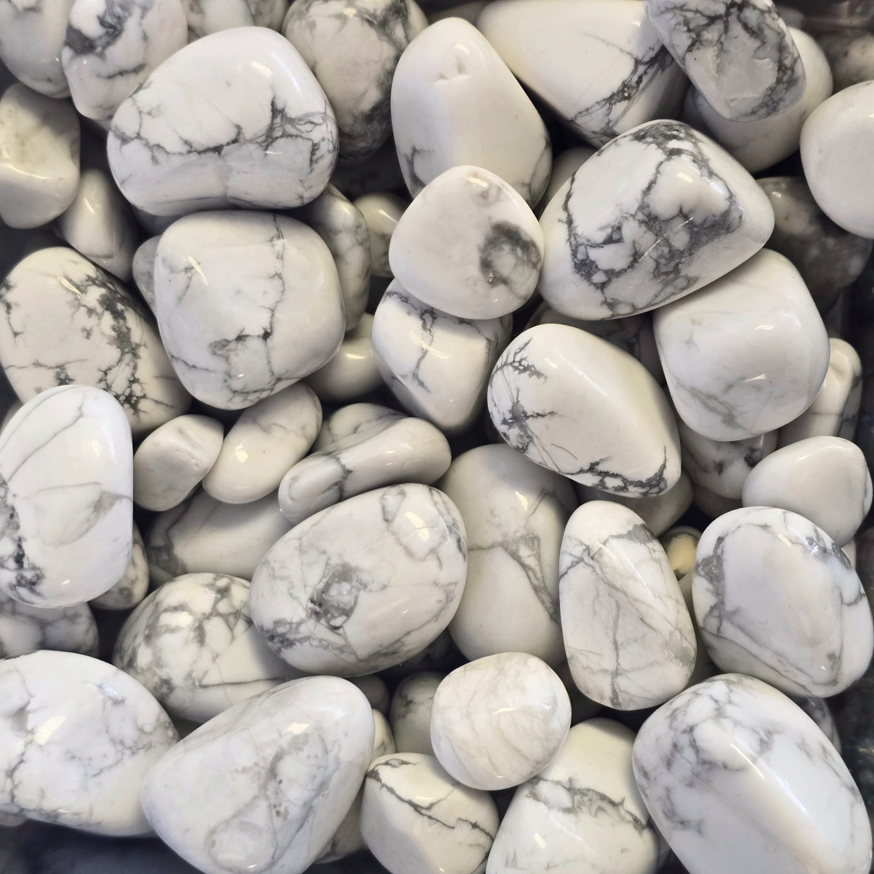 A pile of tumbled howlite
