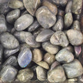 A pile of tumbled labradorite
