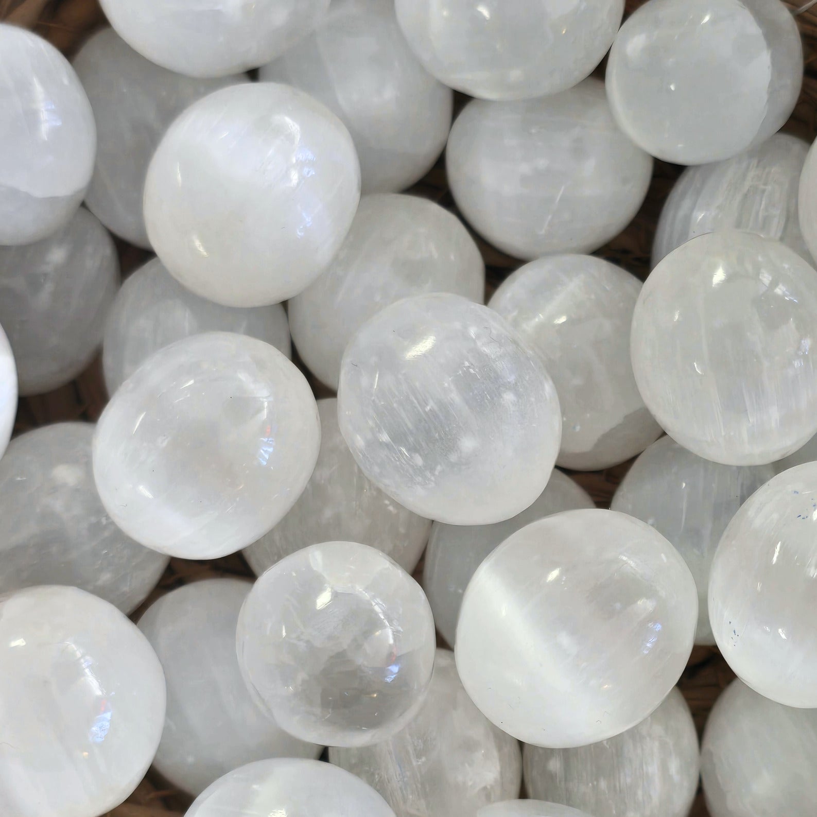 A pile of Tumbled oval Selenite crystals