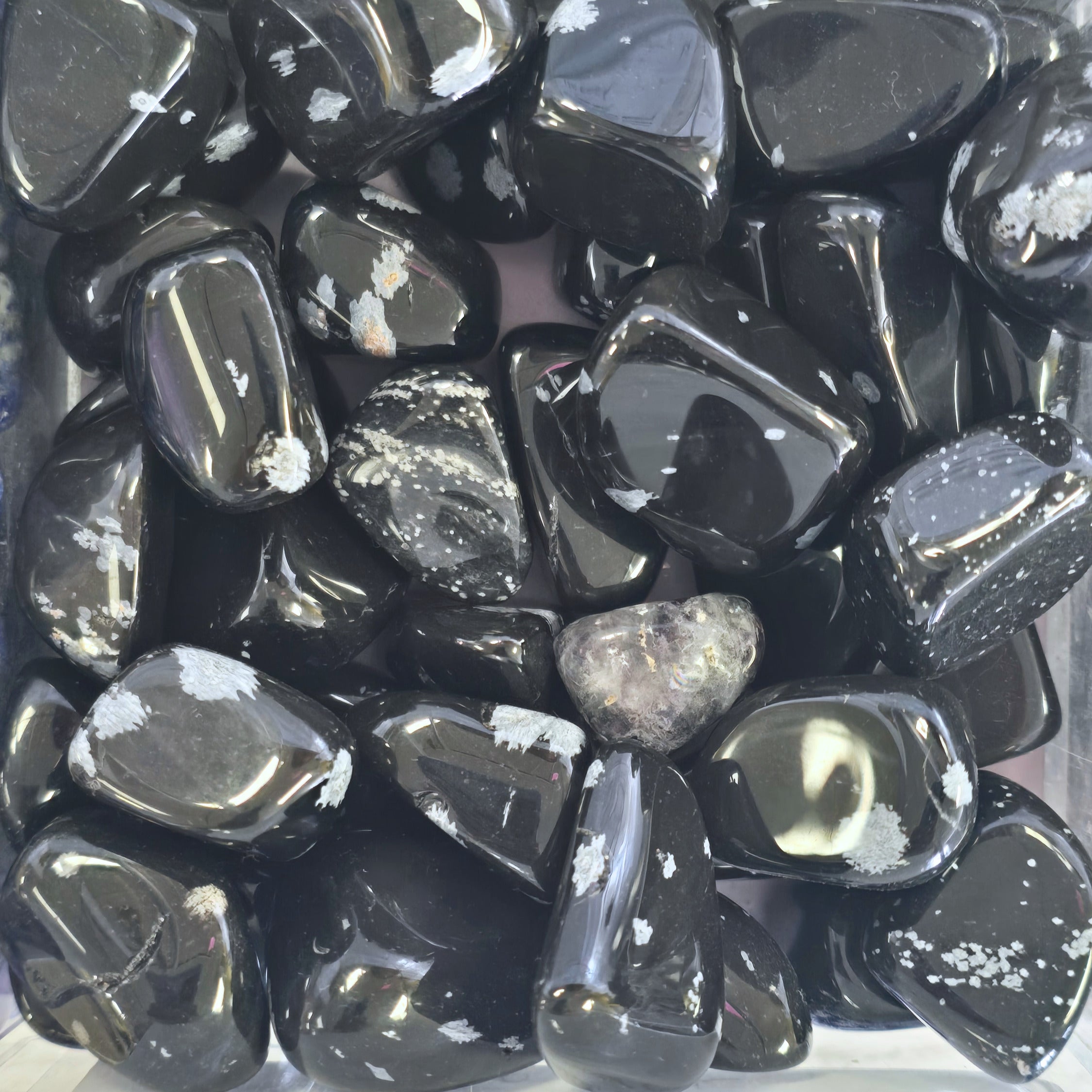 A pile of tumbled snowflake obsidian