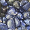 A pile of tumbled sodalite